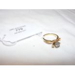 An unusual ladies diamond solitaire ring in 18ct s