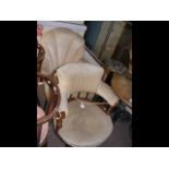 A tub chair and upholstered shell chair