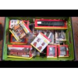 A boxed Hornby coach together with other boxed Hor