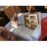 A pale blue three seater sofa