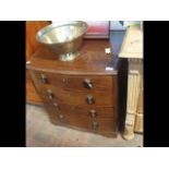 An antique mahogany commode with dummy drawer fron