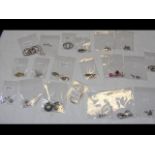 Twenty silver pairs of earrings all marked 925