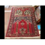 A Middle Eastern prayer rug - 130cm x 95cm