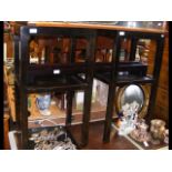 A pair of Oriental style two tier side tables and