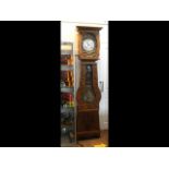 A tall French antique long case clock with decorat