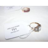 A ladies dress ring, three rectangle stones surrou