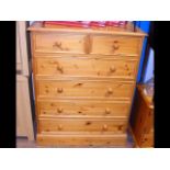 A pine chest of two short and four long drawers wi