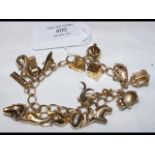 A 9ct charm bracelet - 36 grams