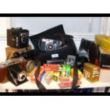 An assortment of cameras and other photographic eq