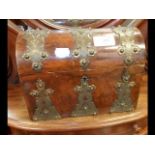 A Victorian walnut dome top jewellery casket conta