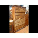 A Georgian walnut chest on chest with cross banded