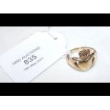 A 9ct gold band of 'hands holding a heart'