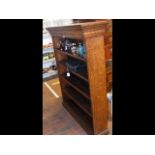 A large oak bookcase with five shelves - width 121