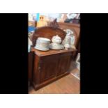 A Victorian mahogany chiffonier with shaped back