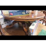 A Victorian walnut coffee table with shaped base a