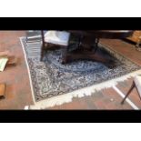 A Middle Eastern style rug with geometric border -