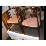 A pair of corner chairs
