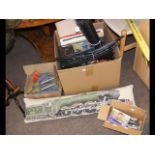 An assortment of model train accessories - track,