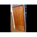 A two door pine wardrobe - width 83cm