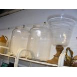 A pair of over-sized bell jars and similarly over-