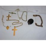 A gold cross and chain, locket etc