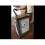A 12cm high brass cased carriage clock by Mappin &