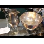 A silver footed bowl together with cream jug