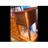 An inlaid mahogany bedside cabinet on square taper