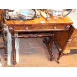 A 19th century work table with stretcher support a