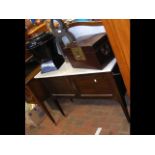 A Victorian washstand with marble top and splash b