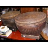 A pair of oriental cane coffee table ottomans