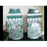 A pair of Oriental Famille Verte vases - 19cms hig