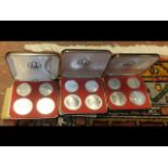 Three cased silver Olympic coin sets