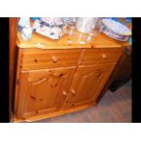 A Scandinavian Redwood pine utility cupboard with