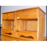 A pair of pine bedside tables with drawers and ape