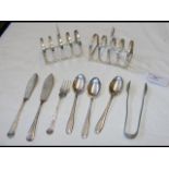 Silver toast racks, flatware