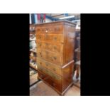 A Georgian walnut chest on chest with decorative b