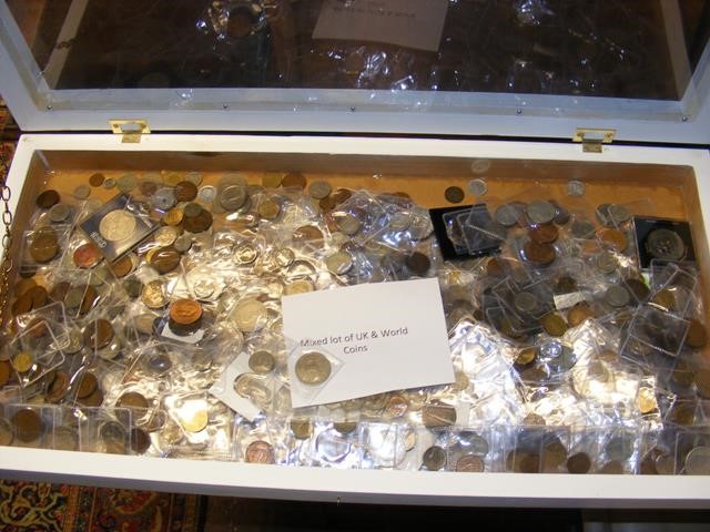 A mixed lot of UK and World coins in display case