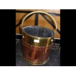 Old copper and brass circular coal scuttle