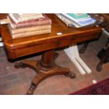 A 19th century rosewood fold over games table