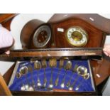 Two mantel clocks together with a part canteen of