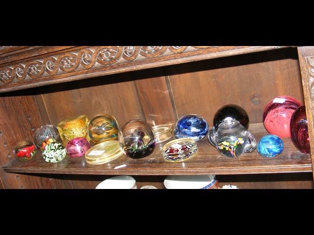 A quantity of glass paperweights, including 'Moon