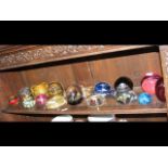 A quantity of glass paperweights, including 'Moon