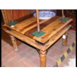 A square coffee table with wrought iron detail - w