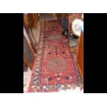 A Middle Eastern runner with geometric border and