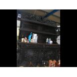 An impressive Victorian carved oak sideboard, the