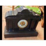 A Victorian slate mantel clock with striking movem