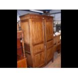 A mahogany two door panelled wardrobe - width 130c