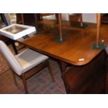 A retro Robert Heritage rosewood dining table with