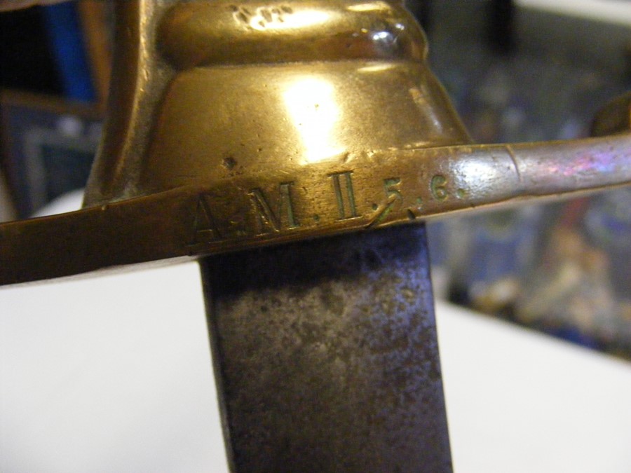 An antique short sword with stylized brass grip an - Image 3 of 5